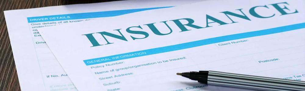 Auto transport insurance paperwork and pen