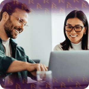 Smiling customers reviewing car shipping quotes together on a laptop