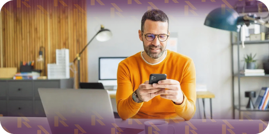 Man negotiating car shipping rates over the phone from home office
